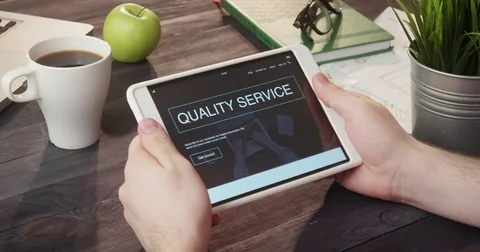 Checking quality service info using digital tablet at desk Stock Footage 80737468