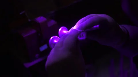 Checking the quality of the valve under UV rays Stock Footage 139697833