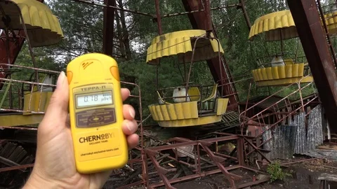 Checking radiation level below the Ferris wheel Stock Footage 117780103