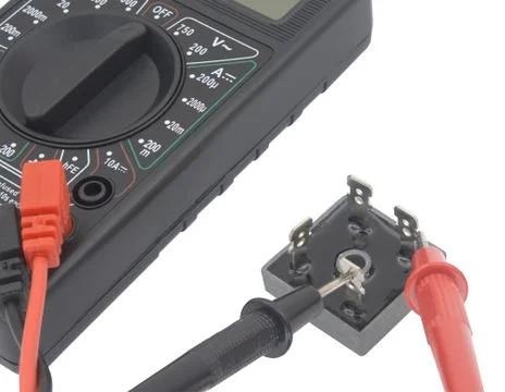 Checking the radio element  with a digital multimeter Stock Photos