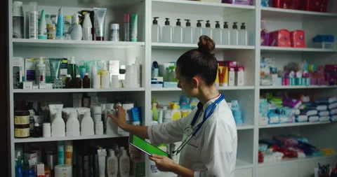Checking recruitment drugs in a pharmacy, checking with a tablet. Pharmacyft Stock Footage 143308719