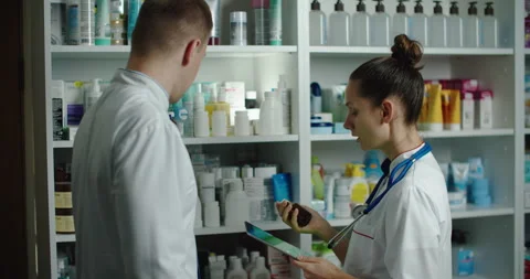 Checking recruitment drugs in a pharmacy, checking with a tablet. Pharmacyft Stock Footage 143353683