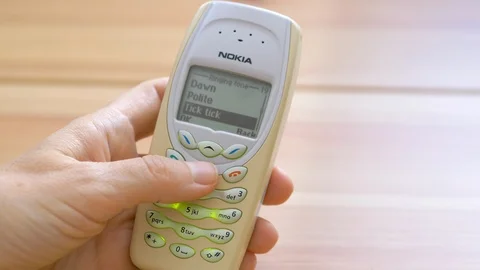 Checking ringtones in an obsolete nokia mobile phone Stock Footage 113791861