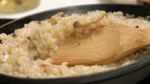 Checking risotto creaminess Stock Footage