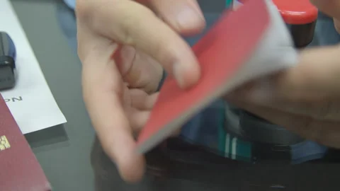 Checking russian military ID passport on the table with stamps and papers Stock Footage 248701193