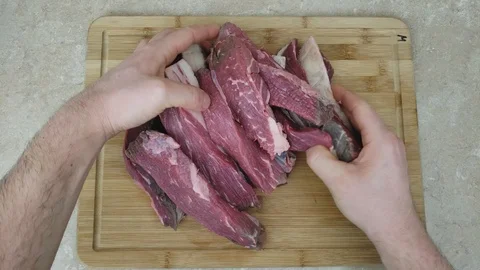 Checking slices of previously portioned beef meat from Top Sirloin Petite Roast 스톡 동영상 104123245