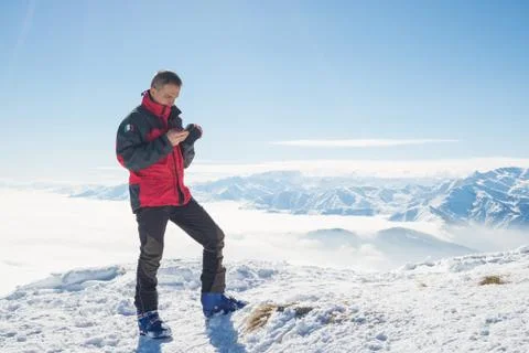 Checking smartphone on the top Foto stock