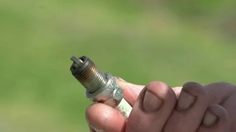 Checking spark plug for deterioration Stock Footage 18033283