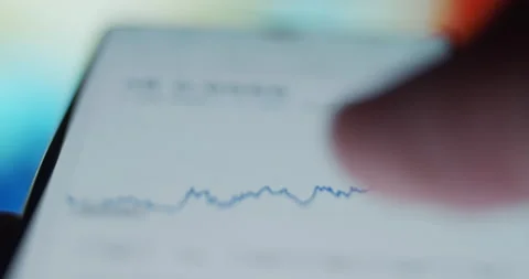 Checking Stock &amp; Crypto Graphics On Smartphone Stock Footage 200925522