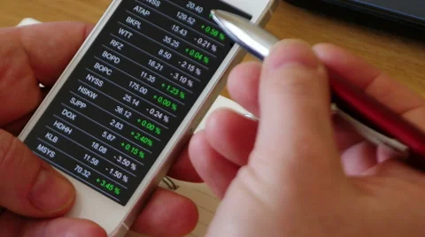 Checking stock market data on smartphone, 4k, UHD Stock Footage 49733802