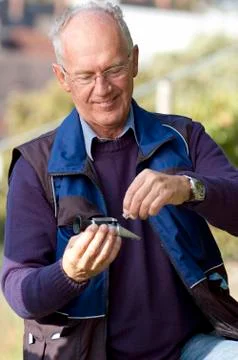 Checking the sugar content of grape Stock Photos