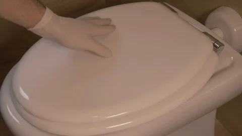 Checking the surface of the toilet for the disinfestation procedure Stock Footage 125428936
