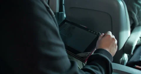 Checking a tablet when driving in the car Stock Footage 61364034