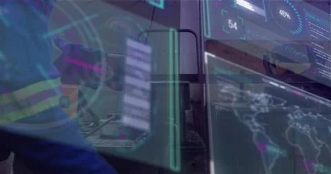 Checking tech in blue hivis jacket, reflective-tape, monitoring HUD at control Stock Photos