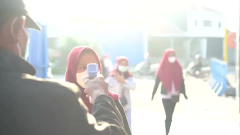 Checking temperature before entering office, COVID-19 coronavirus pandemic Stock Footage 156941841