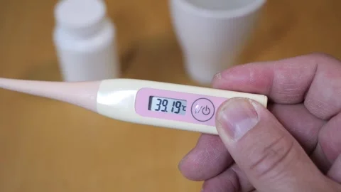Checking temperature at home with digital thermometer Видео 266182310