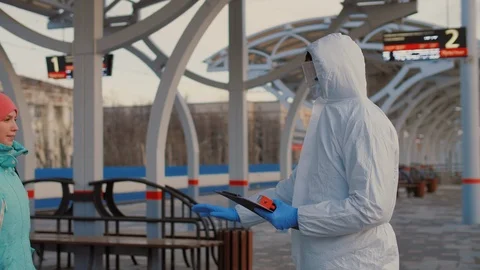 Checking temperature of passengers at platform of railway station Stock Footage 126950586