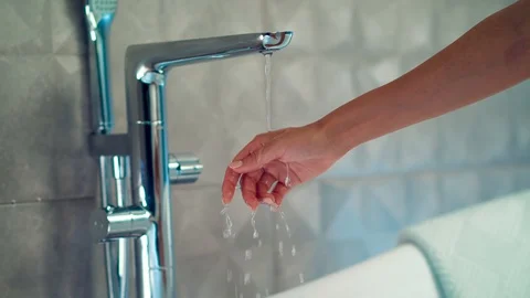 Checking the temperature of water Stock Footage 129709713