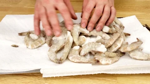 Checking of thawing frozen headless and with shell shrimps Stock Footage 166906788