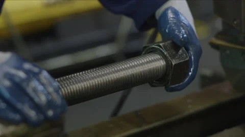 Checking threads on a large bolt with nut Stock Footage 40869616
