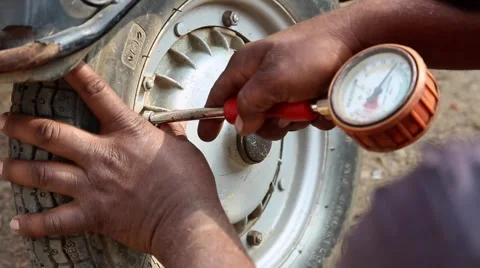 Checking tire pressure Stock Footage 65787286