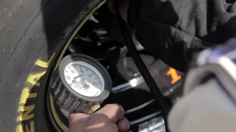 Checking Tire pressure Stock Footage 84802737