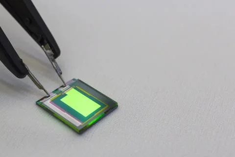 Checking turn on small oled display of green color with a probe station Stock Photos