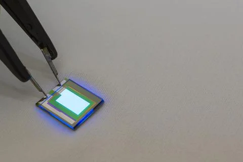 Checking turn on small oled display of blue color with a probe station Stock-Fotos
