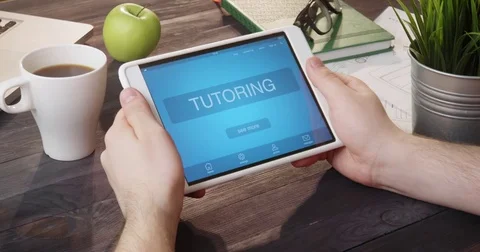 Checking tutoring app using portable computer at desk Vidéo 80720736