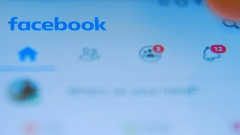 Checking On Twelve New Facebook Notifications - Close Up Shot Stock Footage 122177793