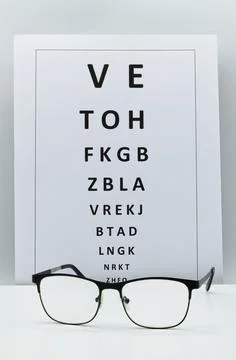 Checking vision table with a pair of glasses. Stock-Fotos