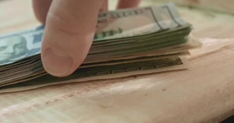 Checking a wad of one hundred dollars 스톡 동영상 321751206