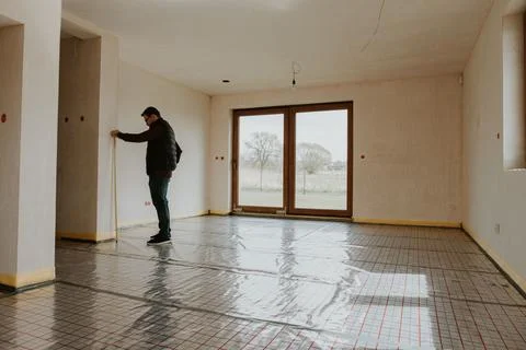 Checking wall with measure tape Stock Photos
