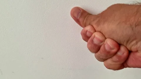 Checking a Wall Surface by Hand During Home Renovation and Repair Work Stock-Footage 345703799