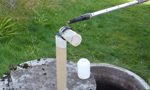 Checking the water quality of a small sewage works Stock Photos