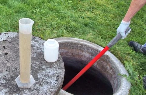 Checking the water quality of a small sewage works Stock Photos