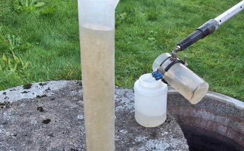 Checking the water quality of a small sewage works Stock Photos
