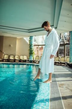 Checking the water temperature Stock Photos