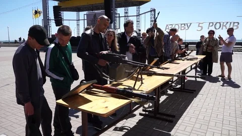 Checking weapons at the square Stock Footage 107897287