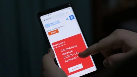 Checking WHO Website During Novel Corona Outbreak Video stock 127002108