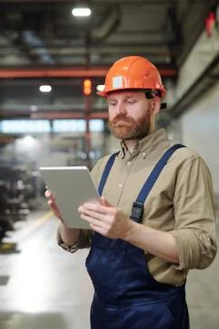 Checking work file on tablet Stock Photos