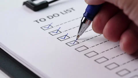 Checklist and To Do List Concept. Closeup businessman tick off on checklist 動画素材 201316069