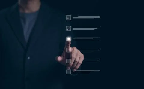 Checklist concept. Businessman using checking marks on online checklist Stock Photos