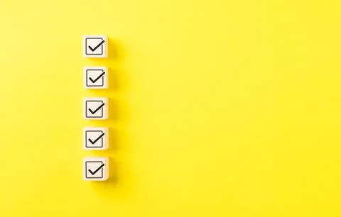 Checklist concept. Correct sign tick check mark on wooden block with copy s.. Stock Photos