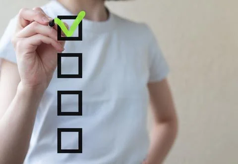Checklist concept, woman checking mark on the check boxes with marker green Stock Photos