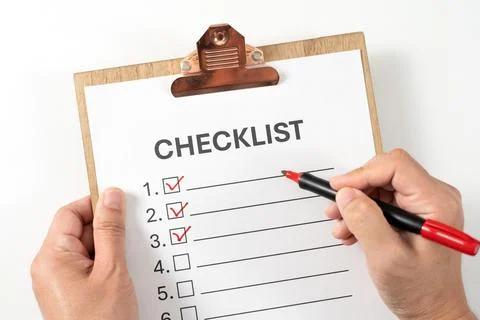 Checklist document on the clipboard with a red marker pen Stock Photos