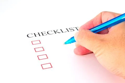 Checklist with pen and checked boxes. Stock Photos