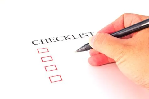 Checklist with pen and checked boxes. Stock Photos