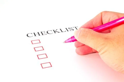Checklist with pen and checked boxes. Stock Photos