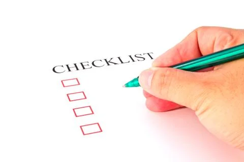 Checklist with pen and checked boxes. Stock Photos